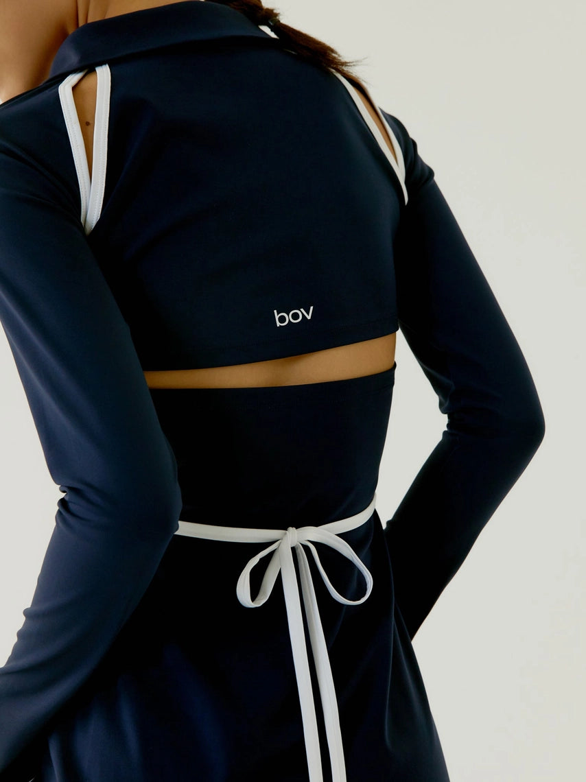 Navy blue long-sleeve top with white drawstrings and 'bov' branding on a plain background