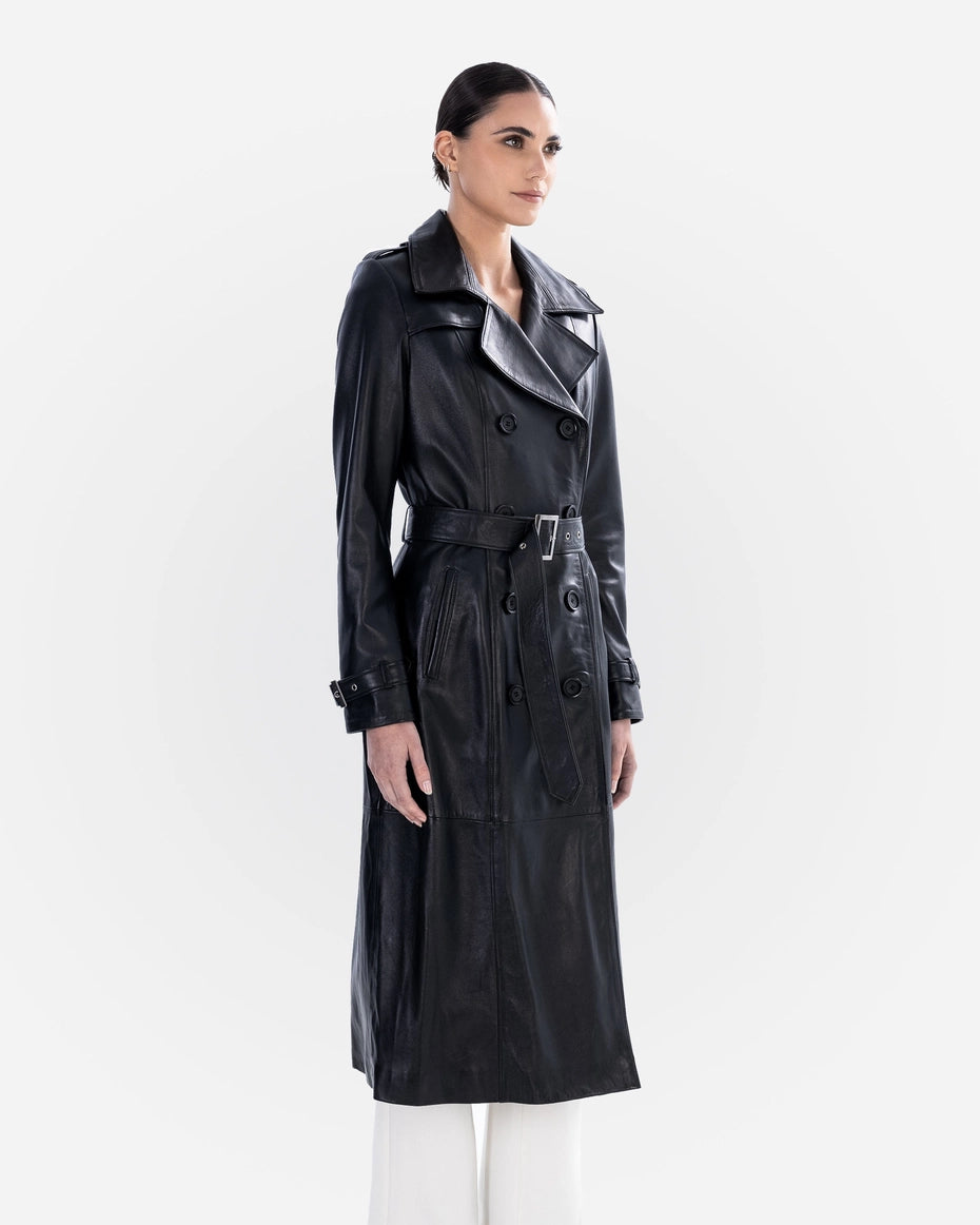 Woman wearing a black leather trench coat on a white background Cuir Dimitri