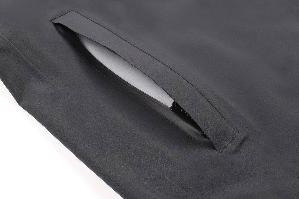 Close-up of a gray fabric pocket with a white object inside on a white background Aparso