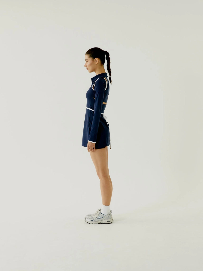 Women wearing a BOV Active navy blue outfit with white accents on a light background