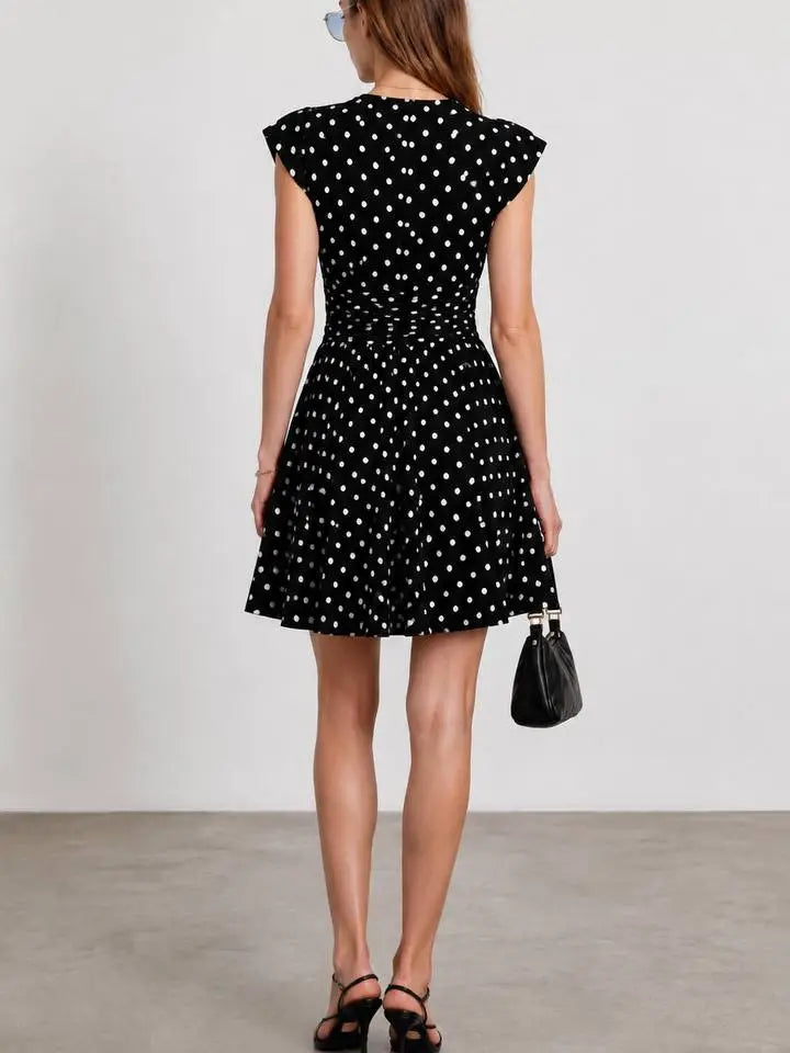 Black and white polka dot ruched waist V-neck mini dress back view with A-line skirt - ANAZ Polka Dot Ruched Waist V-Neck Mini Dress Black