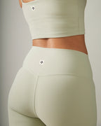 Women Light green ribbed athletic top and leggings set on a neutral background Rose Boreal