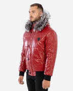 Man wearing a red leather jacket with a fur-lined hood on a white background Cuir Dimitri