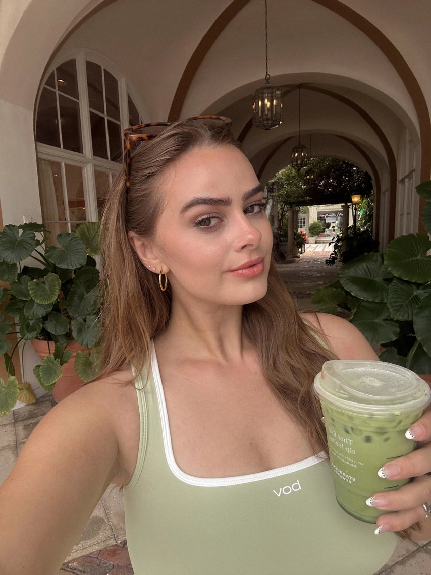 pistachio BOV Active Maeve tank top with white trim driking matcha