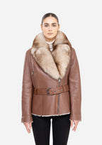 Brown leather jacket with fur collar worn by a model on a white background Cuir Dimitri 