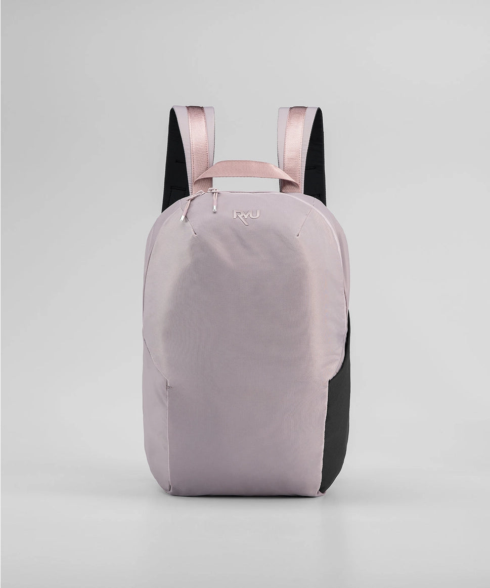 Light purple backpack with pink straps on a light gray background RYU