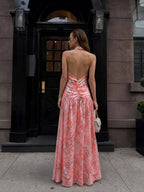 Pink floral halter maxi dress open back with ruched midsection and floor-length skirt back view - ANAZ Floral Halter Maxi Dress Pink