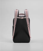 Black backpack with pink straps on a light gray background RYU