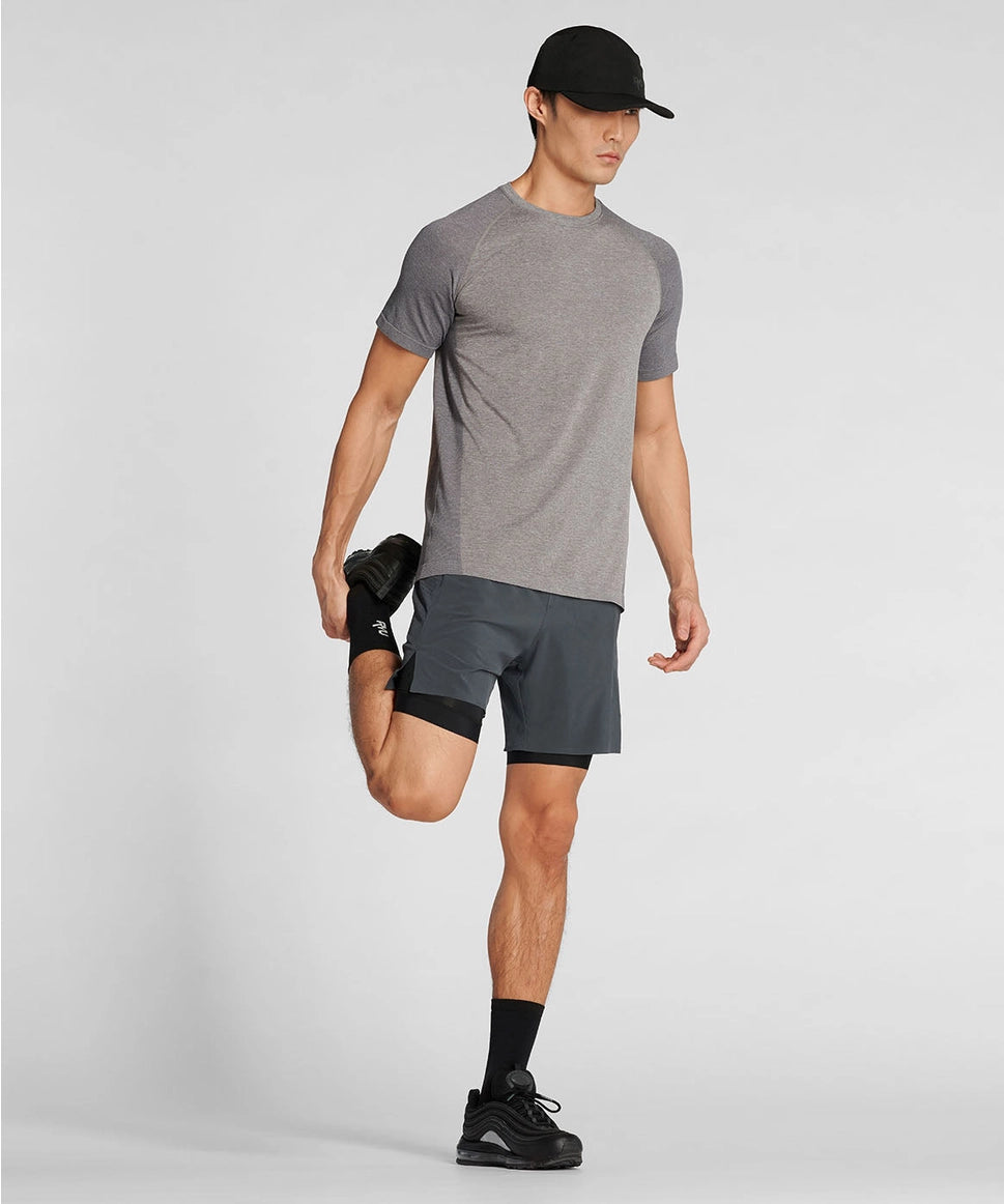 Man in athletic wear posing on a light gray background RYU