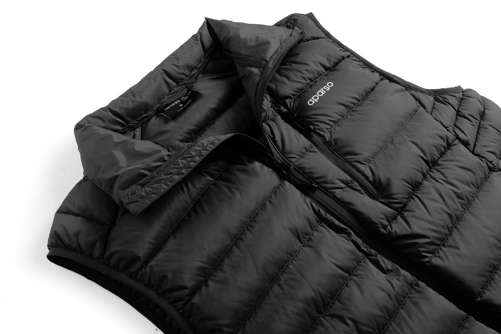Black puffer vest with a brand logo on a white background Aparso