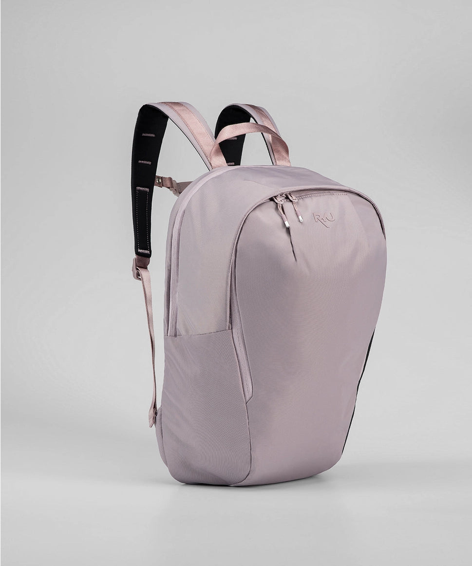 Light purple backpack with black straps on a light gray background RYU