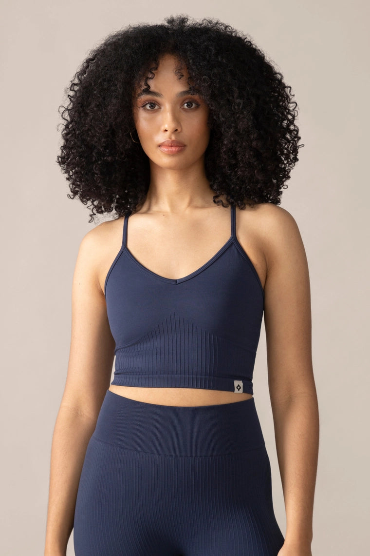 Rose Boreal Woman blue outfit against a beige background