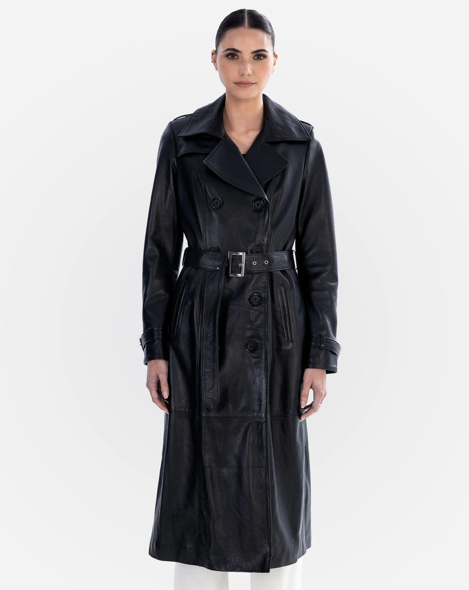Woman wearing a black leather trench coat on a white background Cuir Dimitri