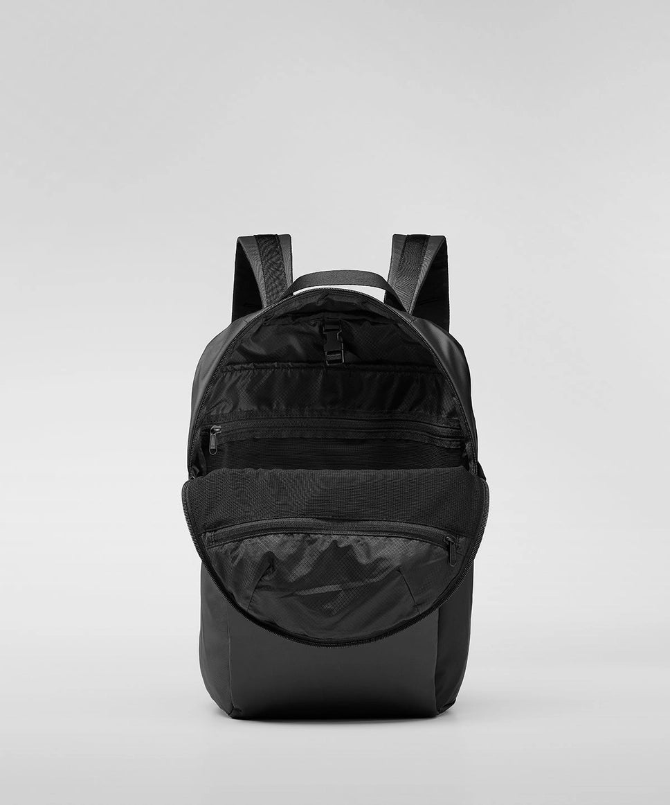 Black backpack on a light gray background RYU