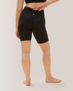 Women wearing black athletic shorts on a plain background Rose Boreal