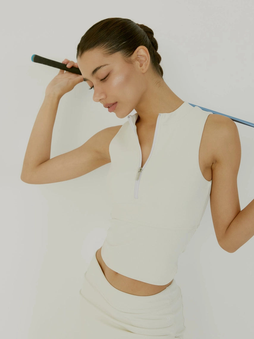 Woman in cream BOV Active Harper top with golf club