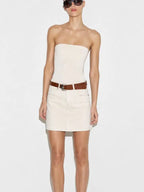 Model wearing ecru denim mini skirt with brown belt and strapless top front view - ANAZ Denim Mini Skirt with Belt
