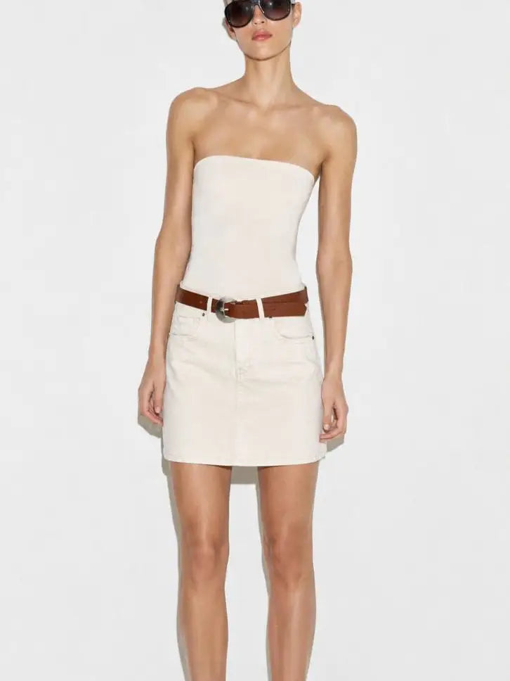 Model wearing ecru denim mini skirt with brown belt and strapless top front view - ANAZ Denim Mini Skirt with Belt
