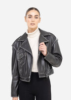 Woman wearing a black leather jacket over a white sweater on a white background Cuir Dimitri