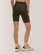 Women wearing olive green athletic shorts on a plain background Rose Boreal