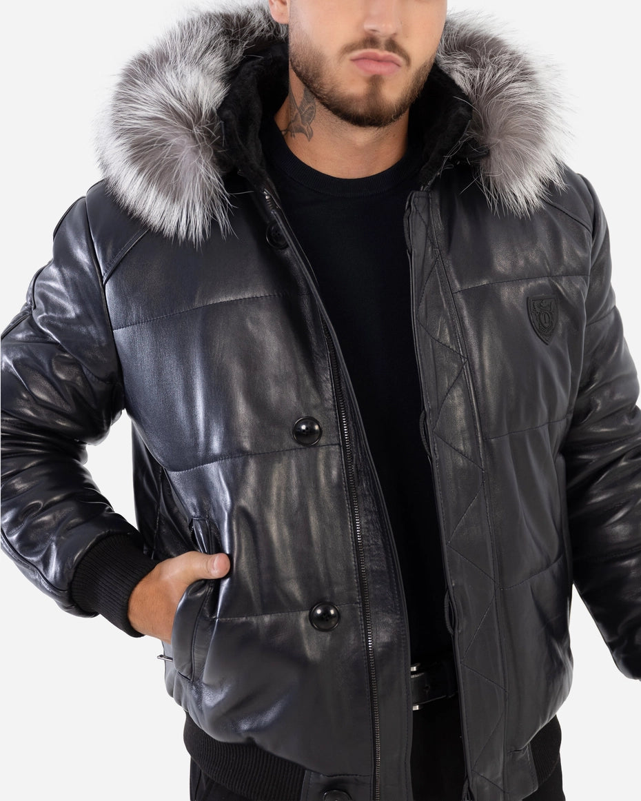 Man wearing a black leather jacket with fur hood on a white background Cuir Dimitri