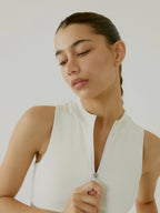 Front view of cream BOV Active Harper top with zipper detail