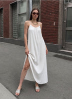 White spaghetti strap maxi slip dress with side slit worn outdoors - ANAZ Maxi Muslin Slip Camisole Summer Dress White
