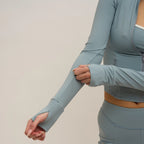 Person wearing a light blue athletic outfit with a neutral background