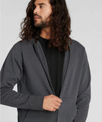 Man wearing a gray hoodie against a plain background RYU