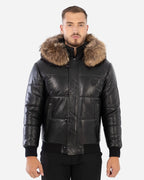 Man wearing a black leather jacket with fur hood on a white background Cuir Dimitri