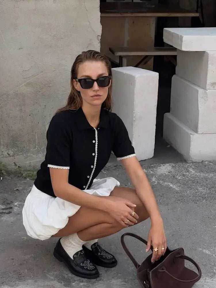 Black crochet trim knit polo cardigan styled with white bubble skirt and loafers street style - ANAZ Crochet-Trim Knit Pol