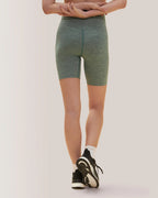 Women wearing green shorts on a plain background Rose Boreal