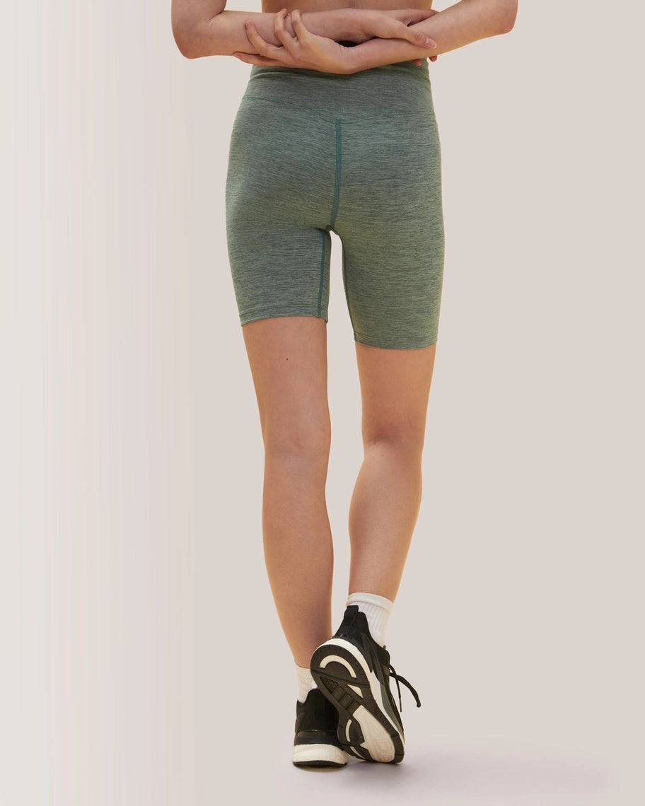 Women wearing green shorts on a plain background Rose Boreal