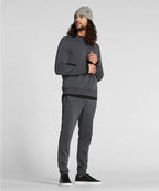 Man wearing a gray sweatshirt and pants with a beanie on a white background RYU