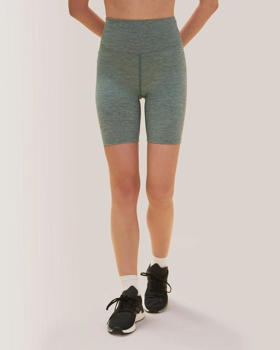 Women wearing green athletic shorts on a plain background Rose Boreal