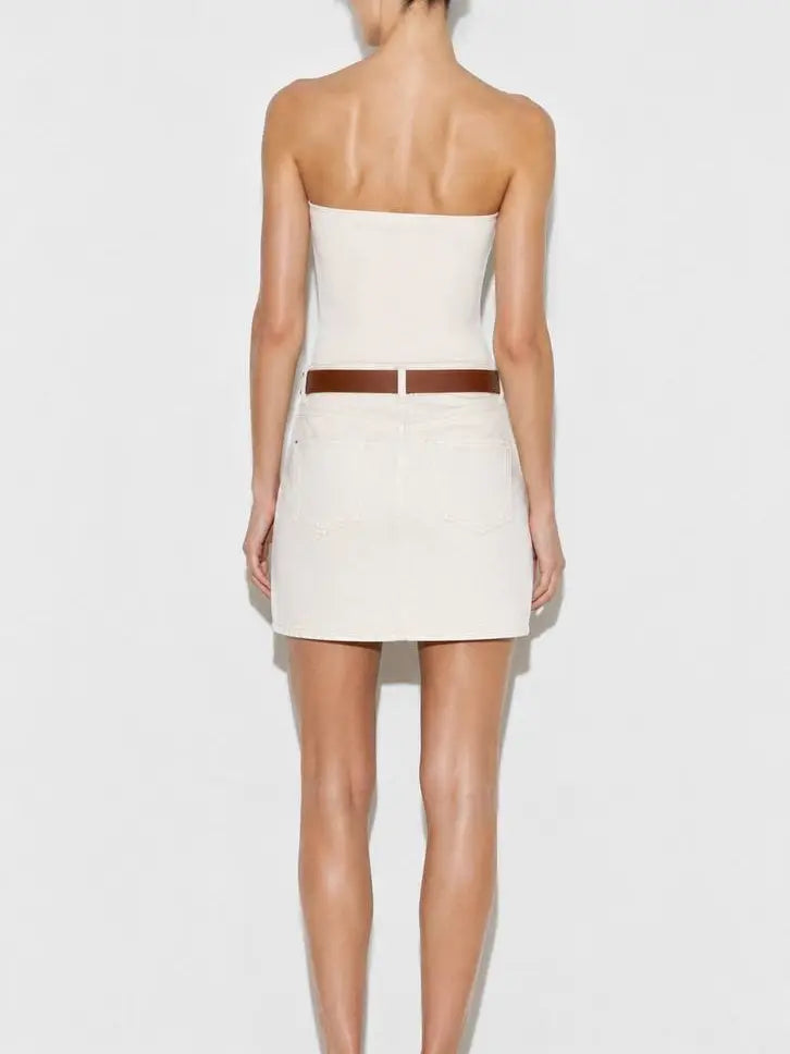 Model wearing ecru denim mini skirt with brown belt back view - ANAZ Denim Mini Skirt with Belt