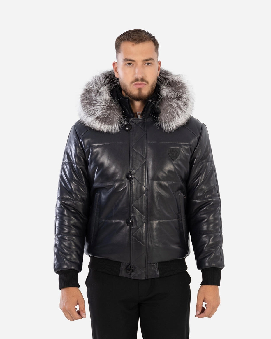 Man wearing a black leather jacket with fur hood on a white background Cuir Dimitri
