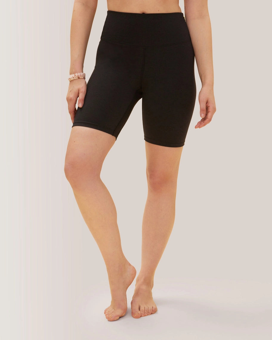 Women wearing black biker shorts on a plain background Rose Boreal