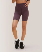 Person wearing purple athletic shorts on a plain background Rose Boreal