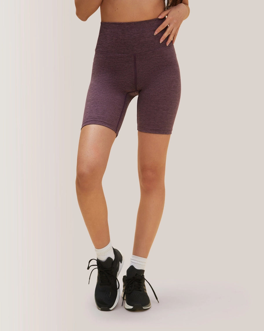 Person wearing purple athletic shorts on a plain background Rose Boreal
