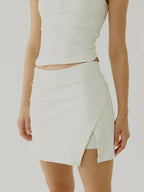 Women wearing cream BOV top and skirt set on a plain background