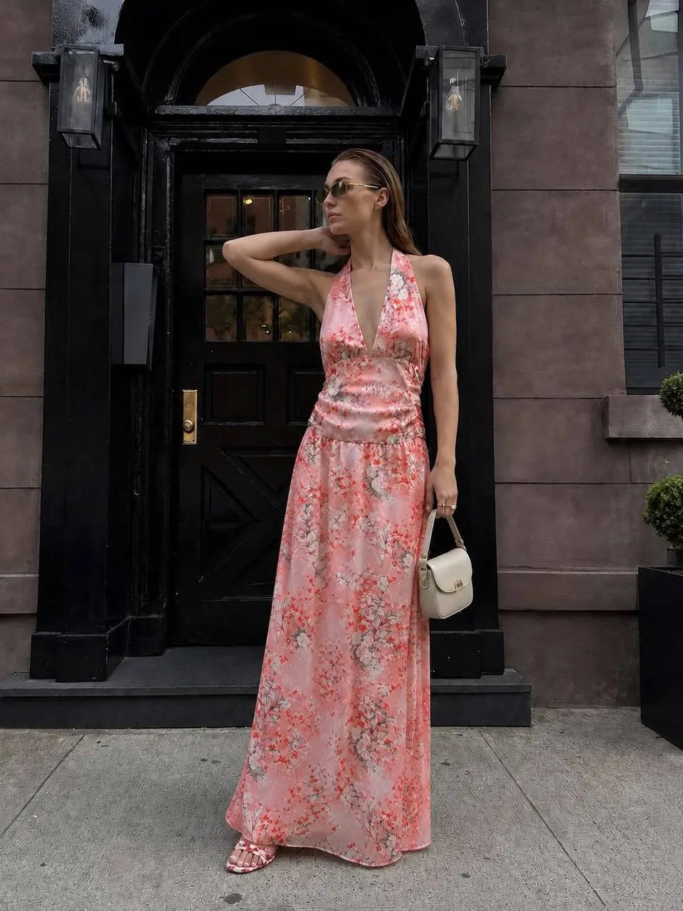 Pink floral halter maxi dress with plunging V-neckline and side ruching front view street style - ANAZ Floral Halter Maxi Dress Pink

