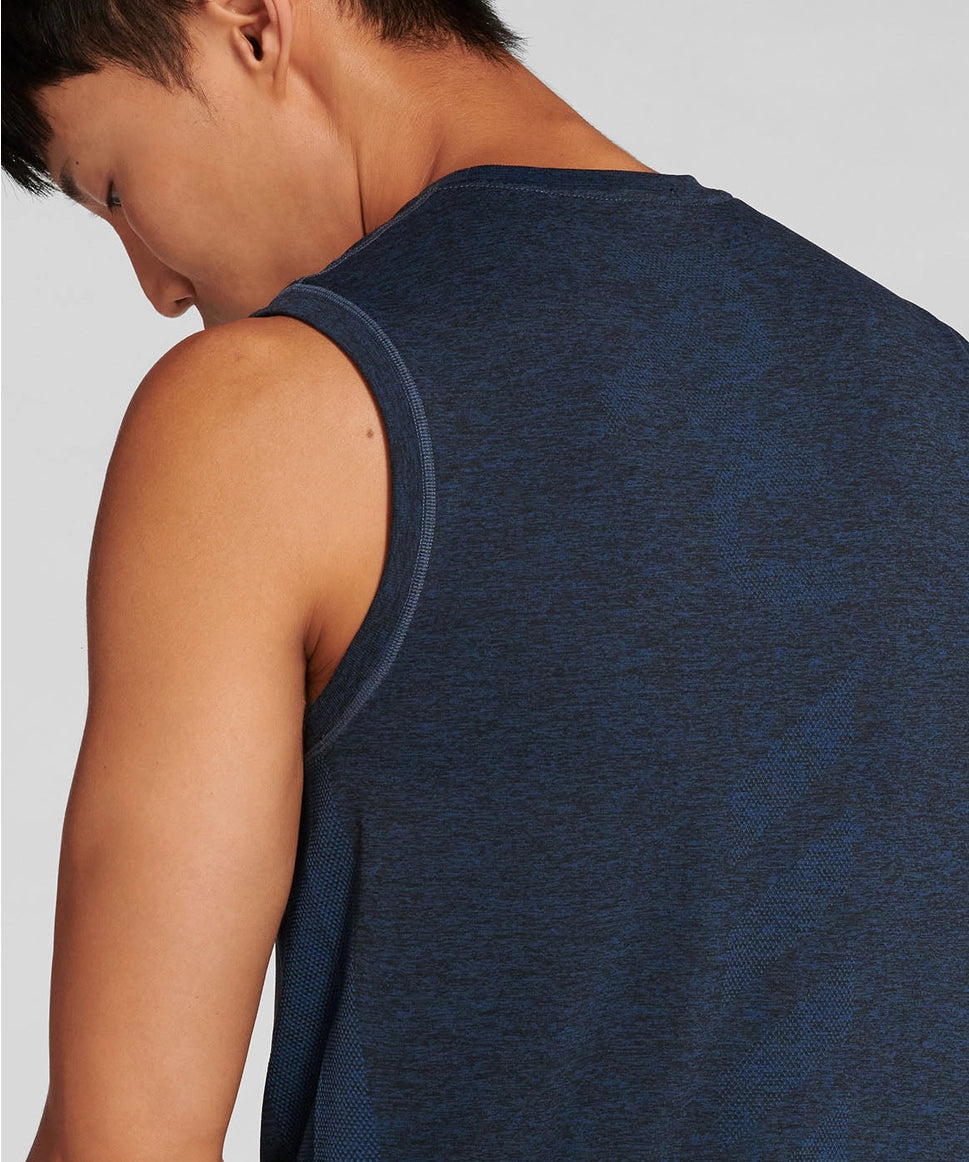 Person wearing a blue sleeveless top on a light gray background RYU