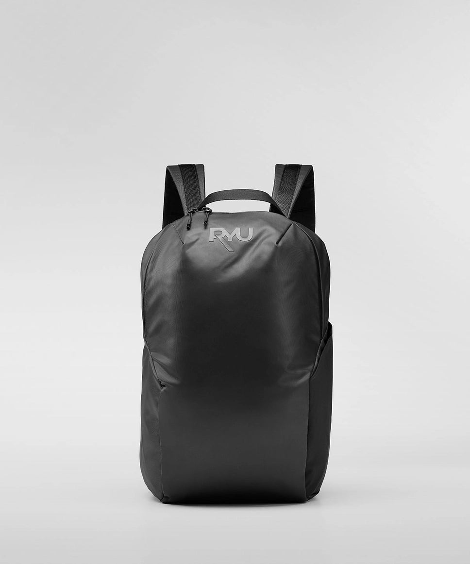 Black backpack with a brand logo on a light gray background RYU