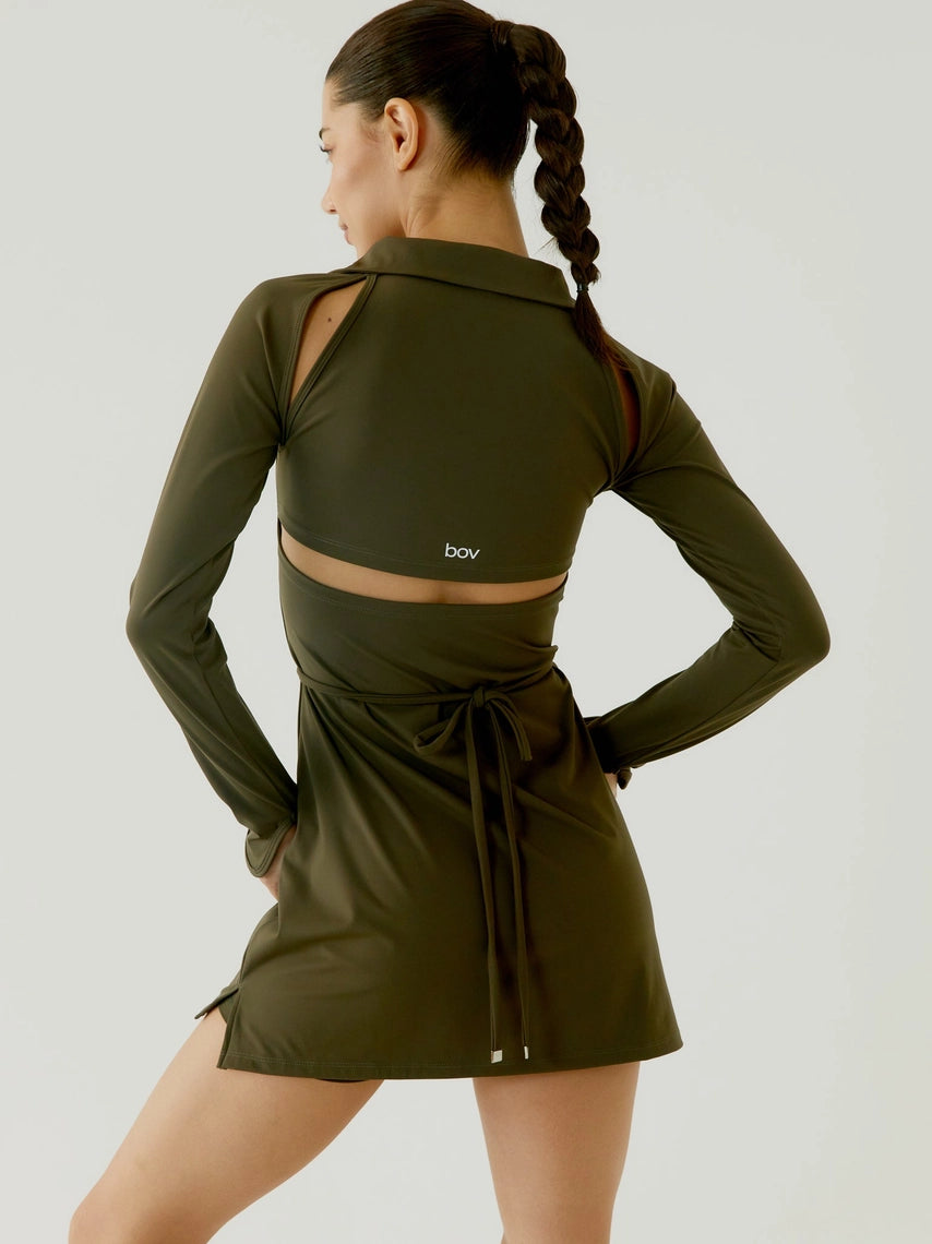 Woman wearing an olive green athletic outfit with a brand logo on a light gray background BOV Active