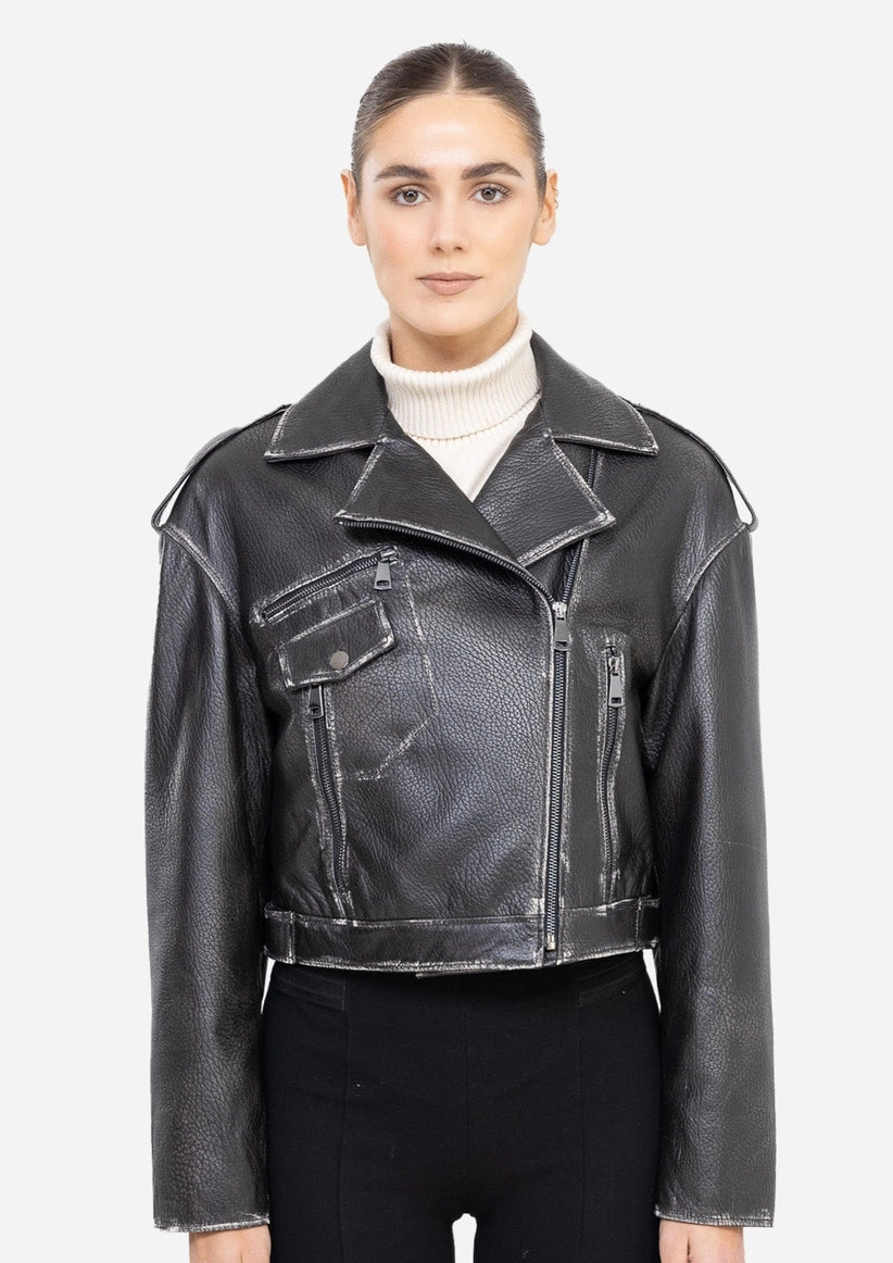 Woman wearing a black leather jacket on a white background Cuir Dimitri