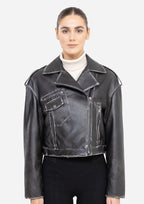 Woman wearing a black leather jacket on a white background Cuir Dimitri
