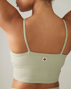 Light green tank top worn by a person on a neutral background Rose Boreal